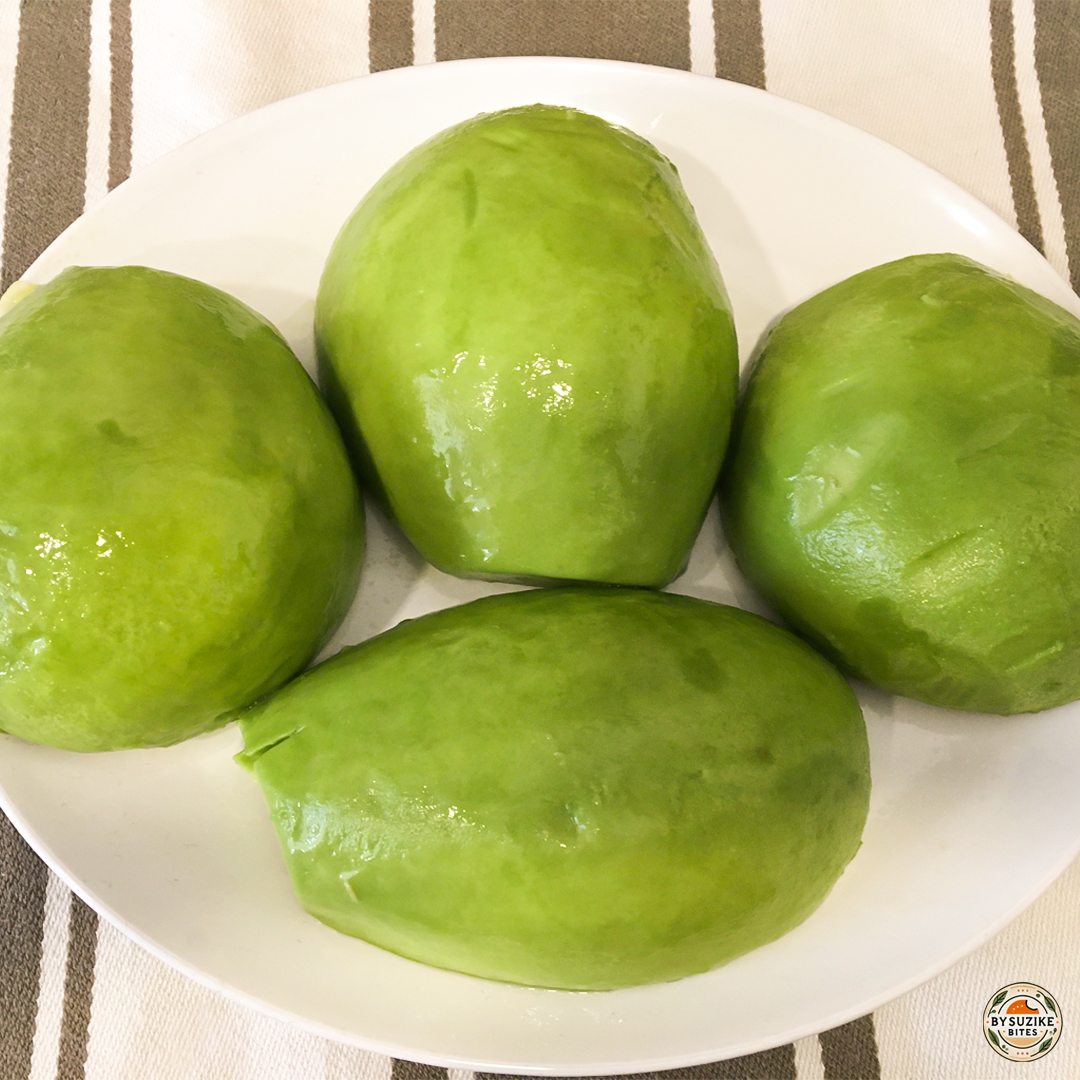 Whole avocados on a plate for making avocado salad.