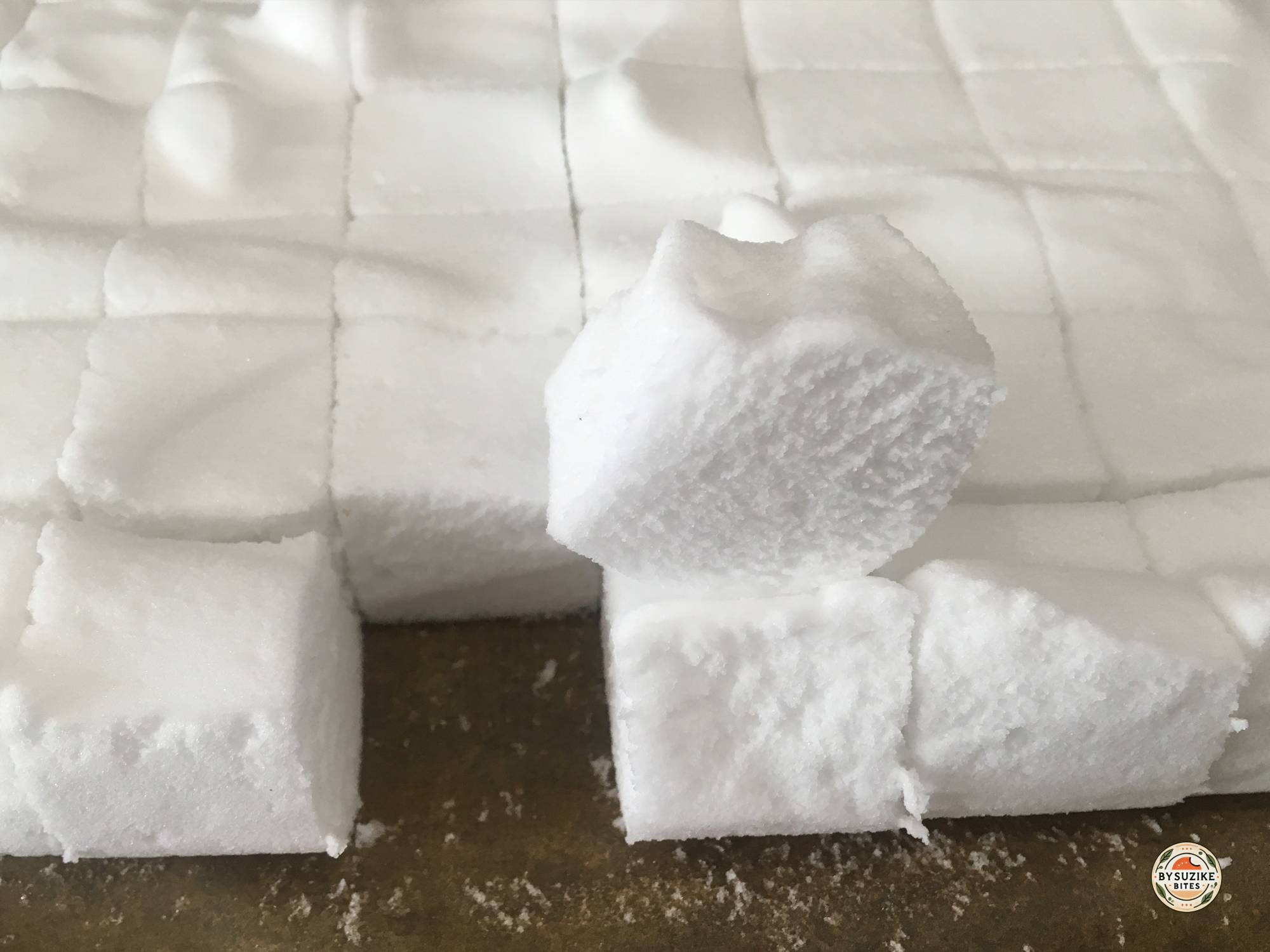 Keto marshmallows cut into squares on a tray.