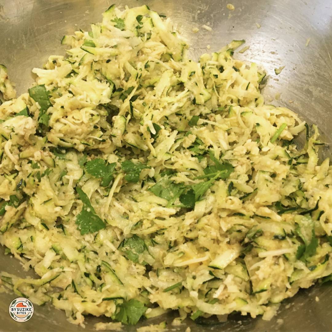Mixed keto zucchini tots batter in a bowl, ready to shape and bake.