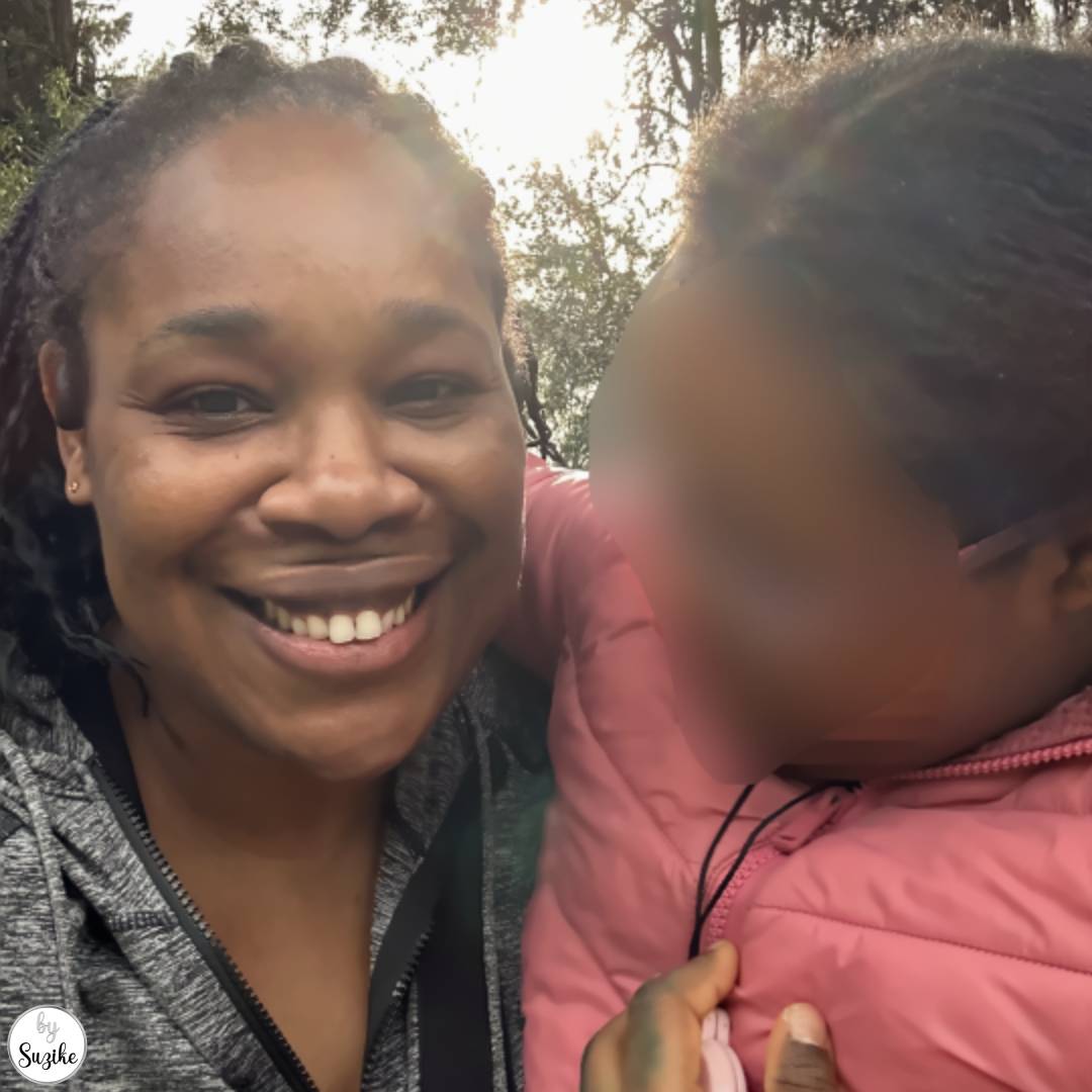 Smiling mother and daughter selfie during an afternoon walk outdoors