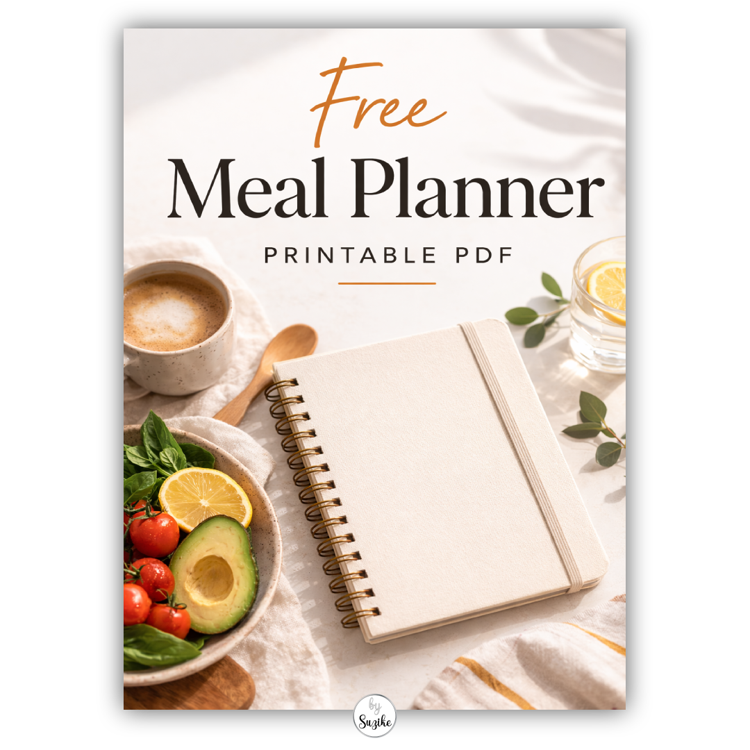 Flat lay cover image for a free meal planner printable PDF with a healthy bowl, avocado, coffee, orange juice, pen and wooden spoon on a clean white background.