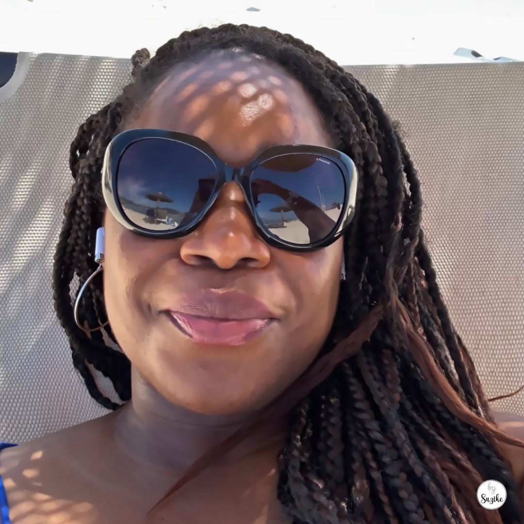 Suzike relaxing on a beach lounger during a solo female travel weekend in Troia Portugal