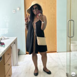 Self-care for mothers after 40 shown through a woman taking a confident mirror photo during a personal moment