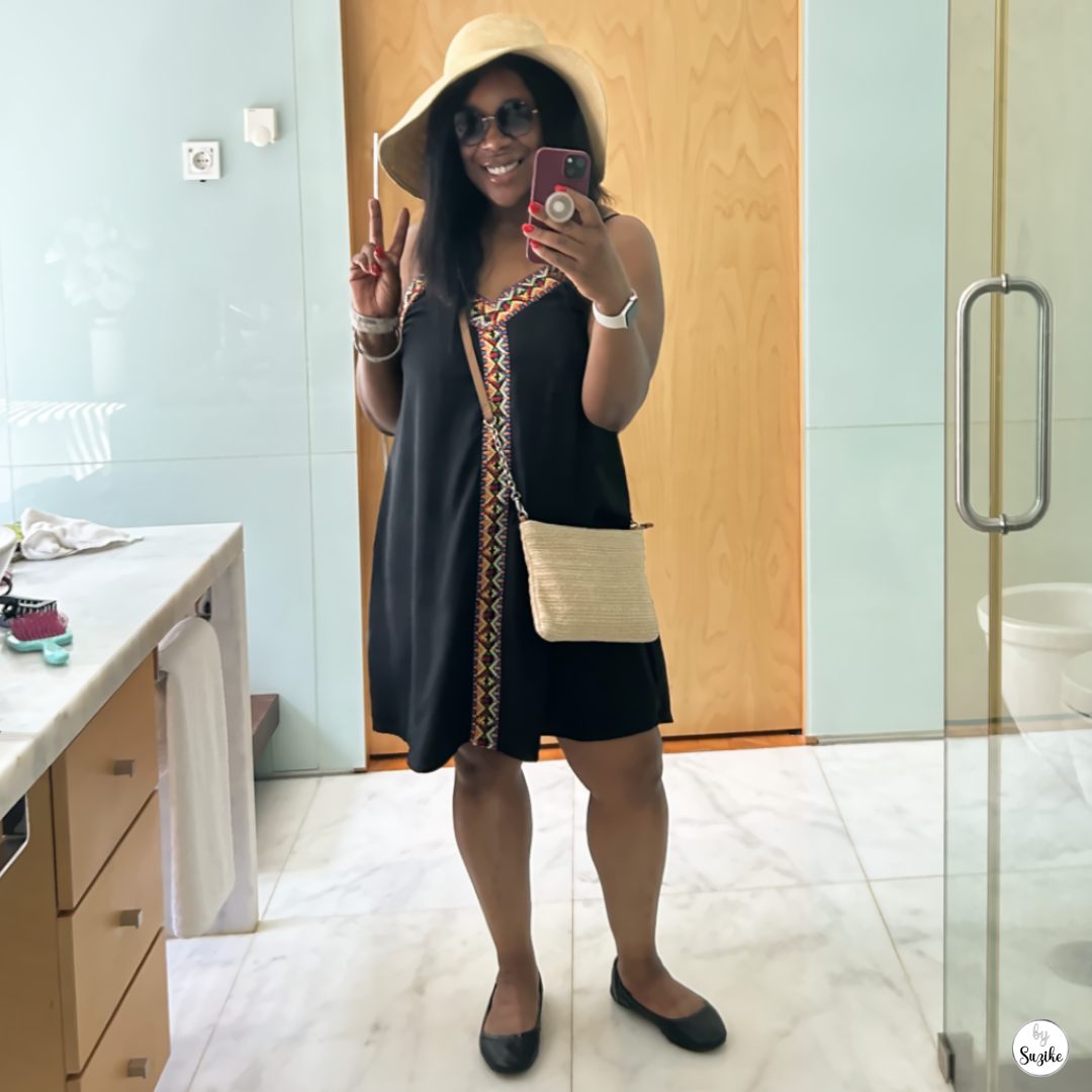Self-care for mothers after 40 shown through a woman taking a confident mirror photo during a personal moment