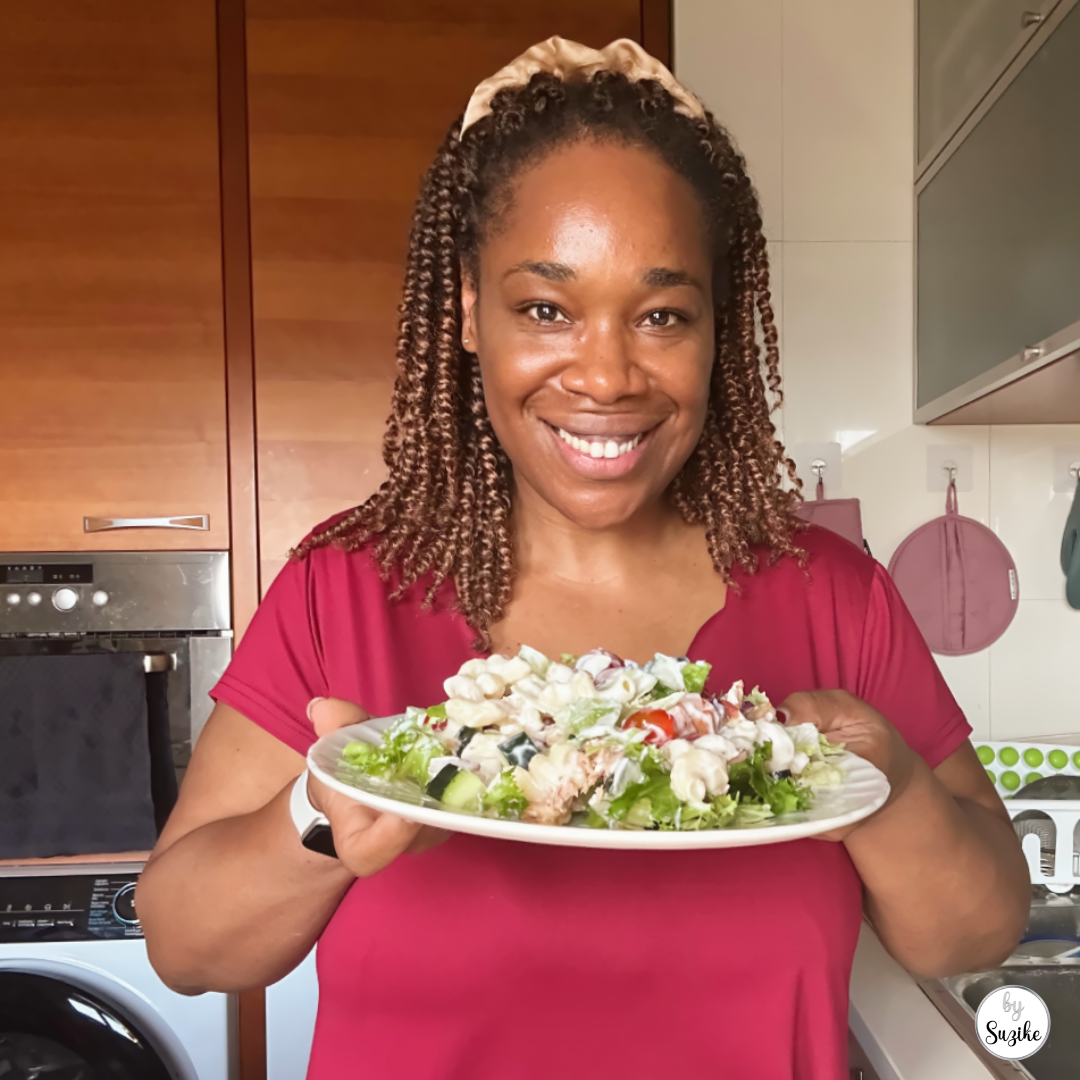 Woman holding a fresh meal prep jar salad on a plate with text about six lunches and two recipes.