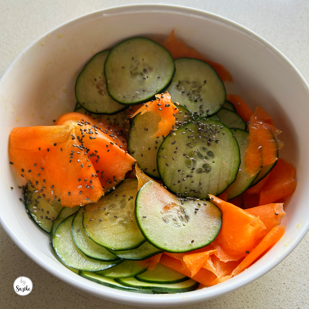 Crunchy cucumber and carrot ribbon salad with balsamic dressing and chia seeds