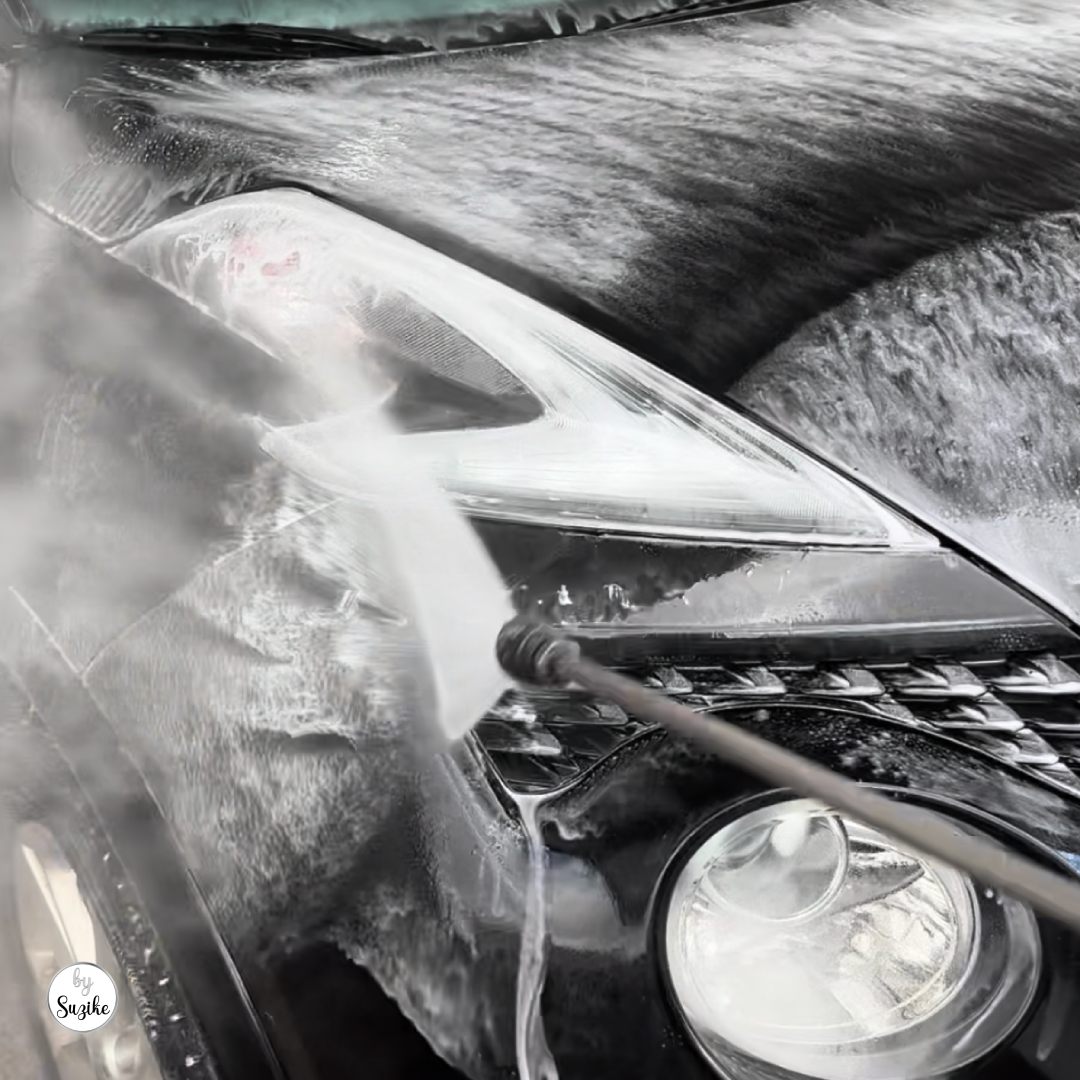 Car covered in foam during the main wash at a self-service car wash in Portugal