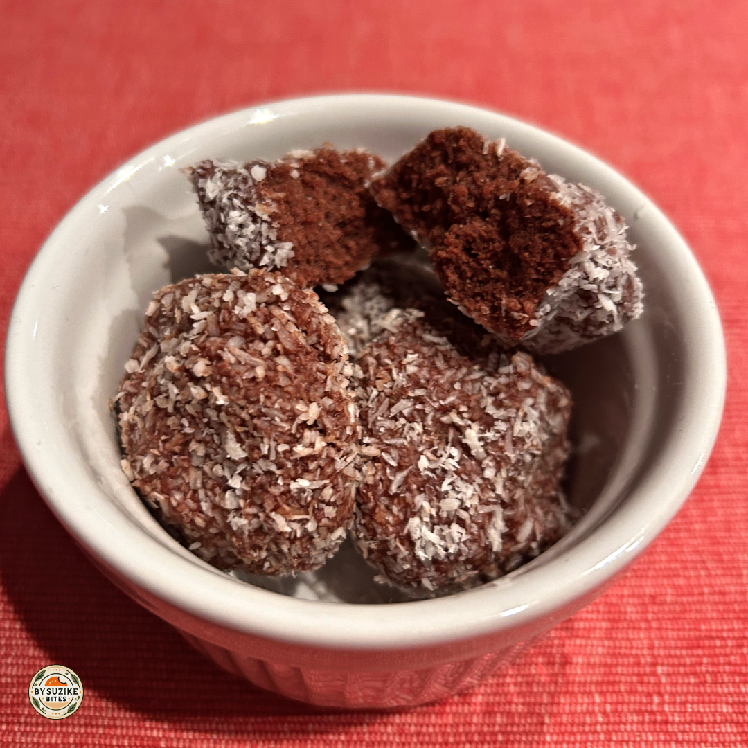 Low carb cocoa coconut truffles coated in shredded coconut