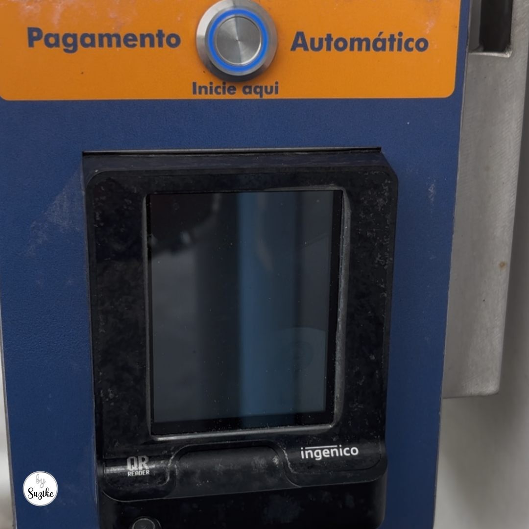 Car parked inside a self-service car wash bay in Portugal